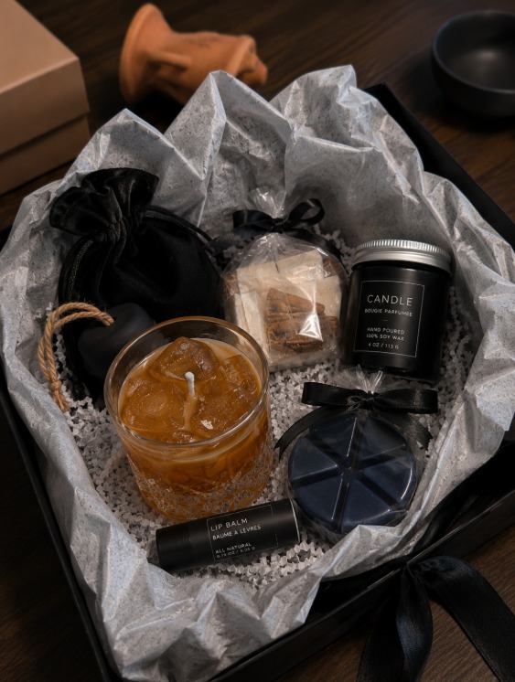 The Cozy Box deluxe set with a hand-poured candle, soy wax melts, lip balm and gel candle in a black gift box