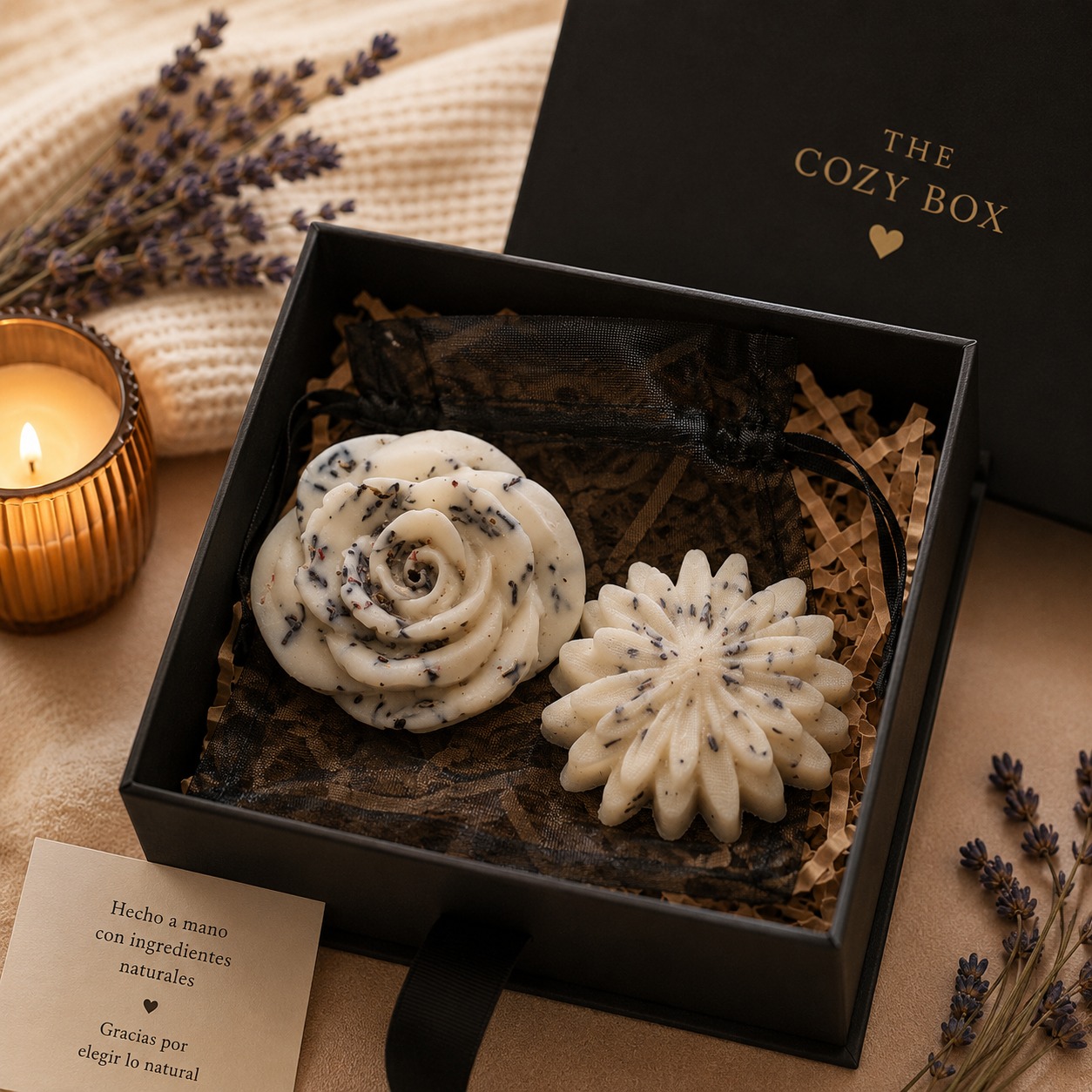A branded The Cozy Box gift box with lavender wax melts, a candle and dried lavender sprigs